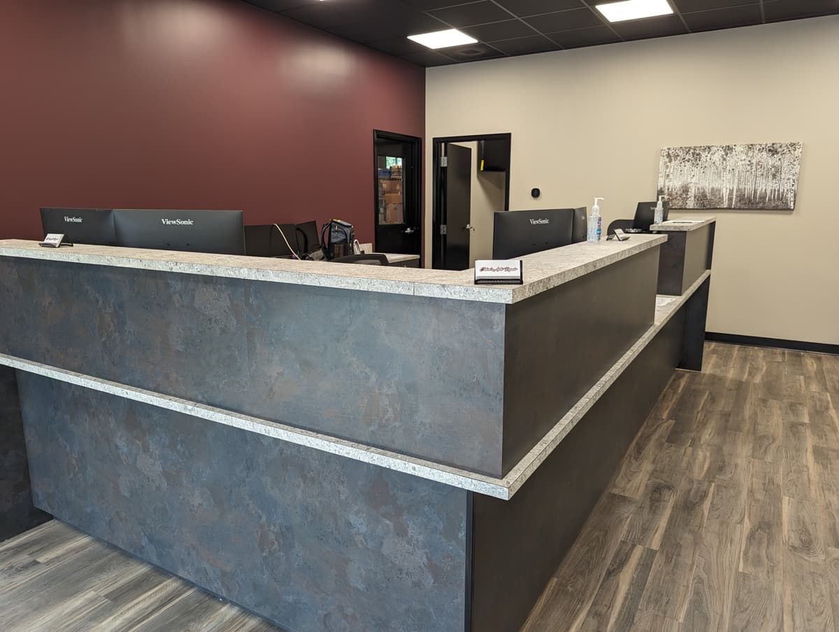 Modern waiting room with seating and business center amenities at Chloe's Auto Repair Kennesaw GA
