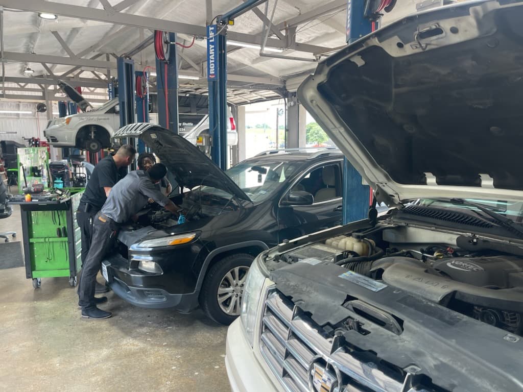 Tire mounting and balancing machine in the service area of Chloe's Auto Repair Spring
