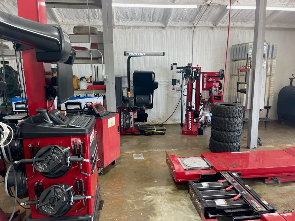 Automotive technician conducting a digital vehicle inspection at the Spring TX shop