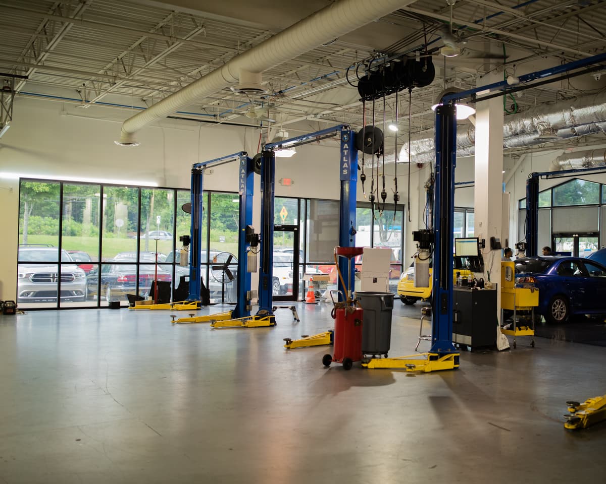 ASE certified mechanics performing engine repair and diagnostics at Woodstock GA shop
